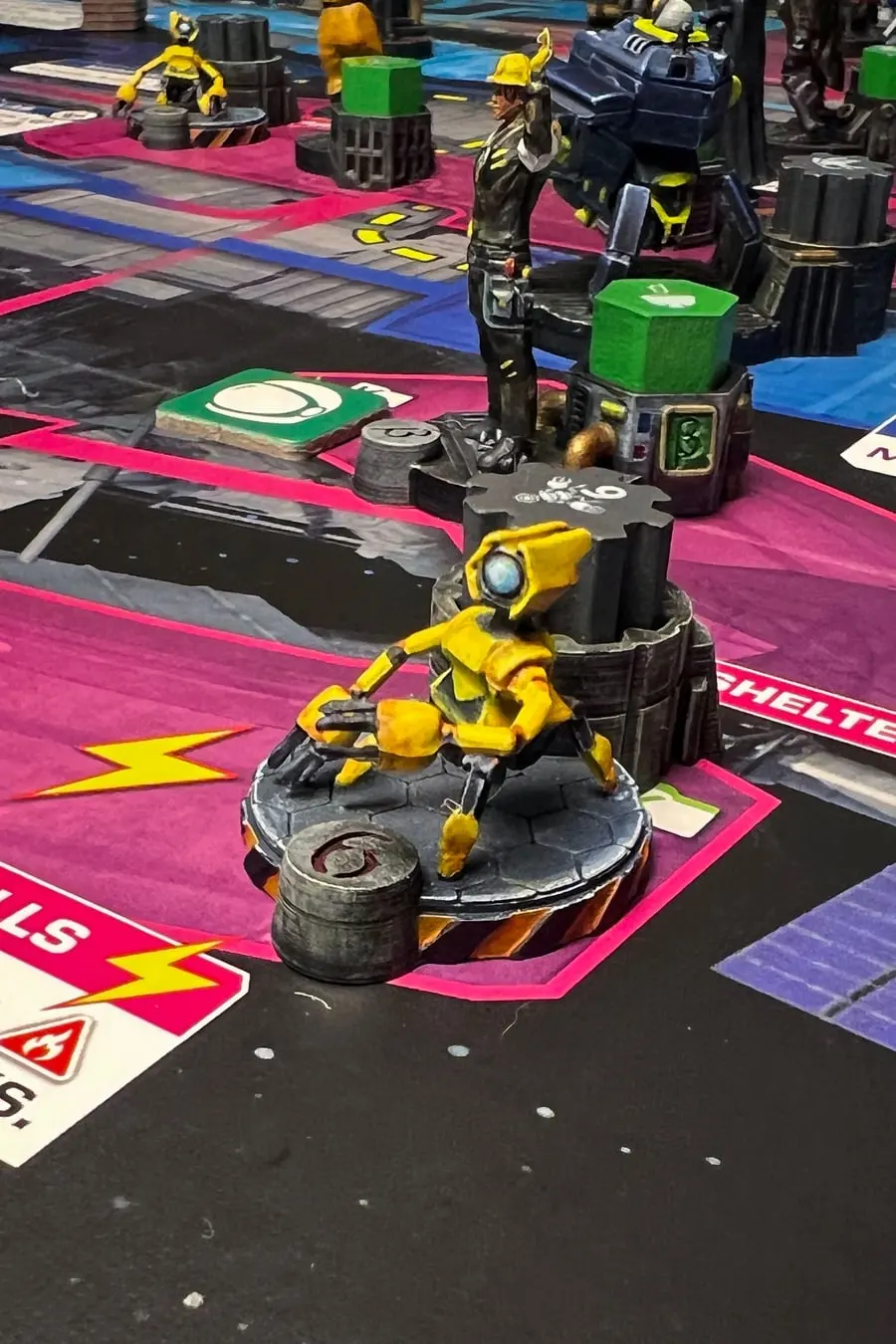 A painted Stationfall miniature on a printed custom base, mid-game.